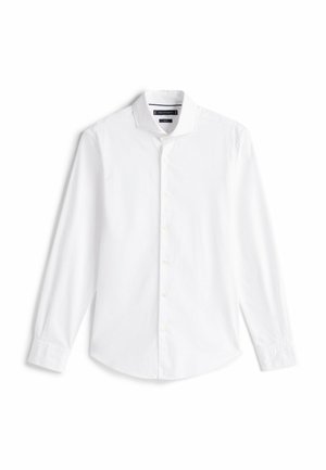 Camicia bianca a maniche lunghe con bottoni realizzata in cotone liscio. Presenta un colletto a punta, una patta frontale con bottoni e un orlo arrotondato.