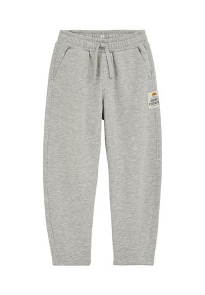 Jasnoszare spodnie dresowe z elastycznym pasem, sznurkiem do ściągania, bocznymi kieszeniami i małą beżową metką na prawej udzie.