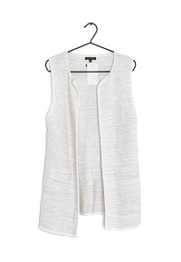 Lätt, strukturerad ärmlös väst i off-white med två framfickor och öppen framsida. Hänger på en svart krok.