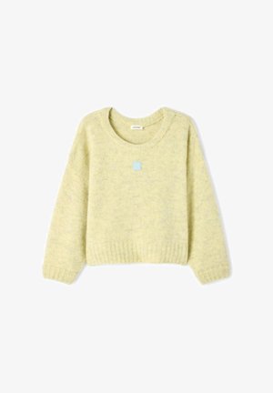 Sveter v háčkovanom štýle, svetlo žltej farby, s okrúhlym výstrihom, spustenými ramenami a rebrovanými manžetami. Na prednej strane sa nachádza malý modrý logotyp.