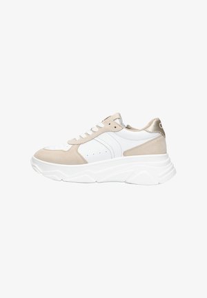 Sneakers with a combination of white leather and beige suede, featuring a chunky white sole and metallic gold accents on the heel.