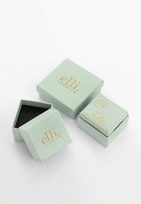 Geschenkboxen in Minzgrün mit goldener Schrift, in sechseckiger und quadratischer Form, aus strukturiertem Papier, mit offenem Deckeldesign und schwarzem Innenraum.