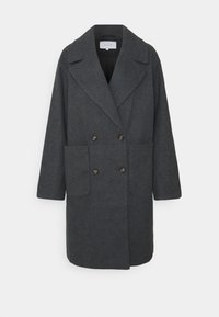 Mörkgrå dubbelknäppt kappa i en texturerad tyg. Har stora framfickor och en bred slag. Knapparna är mörka och runda.