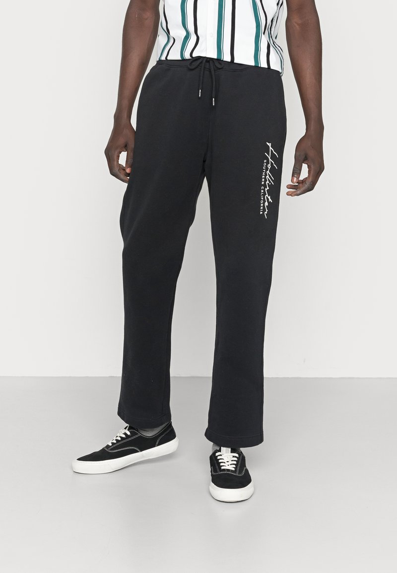 Hollister Co. TONAL TECH LOGO Tracksuit bottoms black Zalando.de