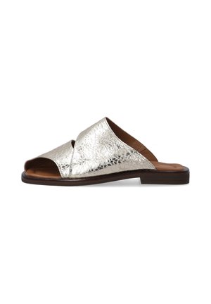 Metallic silver slide sandal with a textured surface, open toe, and crossover design. Brown insole and a flat brown outsole.