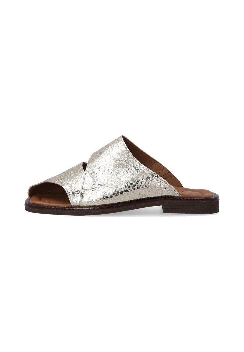Metallic silver slide sandal with a textured surface, open toe, and crossover design. Brown insole and a flat brown outsole.