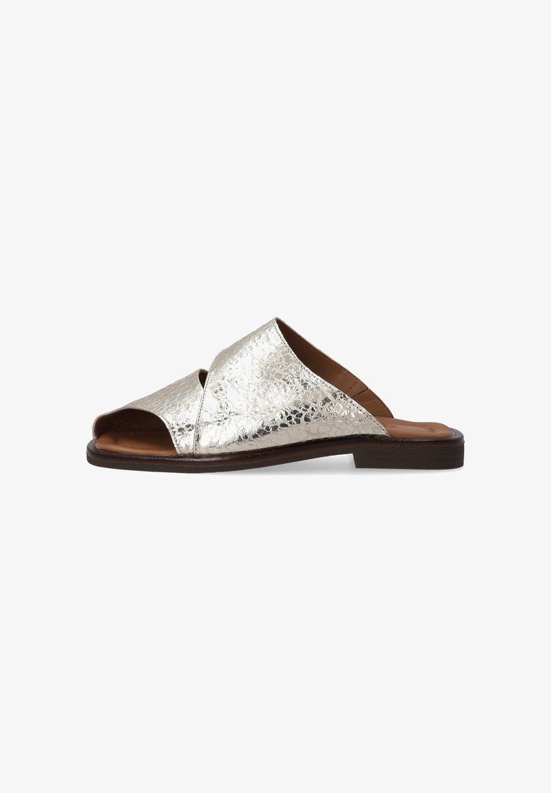 Metallic silver slide sandal with a textured surface, open toe, and crossover design. Brown insole and a flat brown outsole.