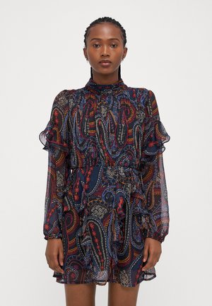 Long-sleeve, ruffled dress with a high neckline; features a navy base and multicolored paisley print with floral accents and sheer fabric.