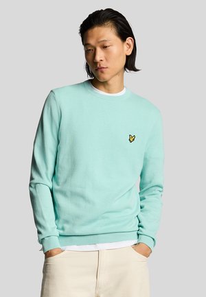 Mintgrüner Sweatshirt mit langen Ärmeln und Rundhalsausschnitt. Mit einem kleinen gelben gestickten Logo auf der linken Brust. Weiche Textur.