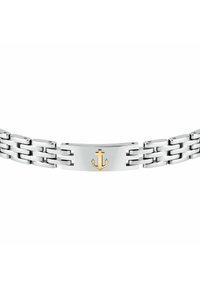 Bracciale in metallo tono argento con maglie spesse, caratterizzato da una placca centrale lucidata decorata con un simbolo di ancoraggio dorato.