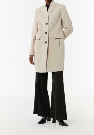 Halflange jas - beige