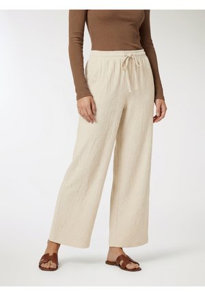 - Spodnie materiałowe