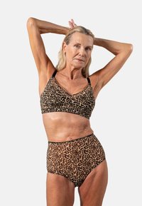 BH und hochgeschnittene Unterwäsche im Leopardenmuster in Beige und Schwarz. Der Stoff ist dehnbar und hat eine glatte Textur mit kontrastierenden schwarzen Besatzdetails.