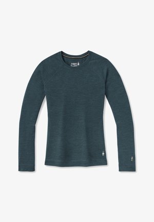 Camiseta de manga larga en color teal con un cuello redondo, fabricada en tejido suave. Presenta mangas tipo raglán y un pequeño logo en el lado inferior.