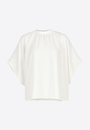 Blouse blanche à manches courtes avec un col montant et une coupe décontractée. Tissu doux et texturé avec une silhouette fluide et drapée.