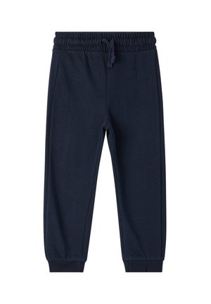 Pantaloni tuta blu navy con vita elastica e cordoncino, gambe affusolate e polsini alla caviglia a coste. Tessuto morbido e testurizzato senza pattern.