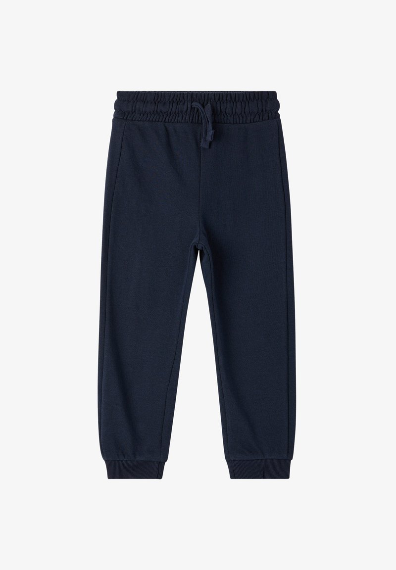 Granatowe dresy z elastycznym pasem i sznurkiem, zwężane nogawki oraz ściągacze na kostkach. Miękka, teksturowana tkanina bez wzorów.