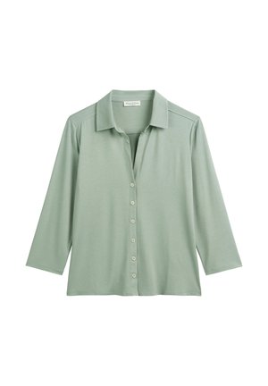 Light green collared shirt made of soft fabric. Features three-quarter sleeves, button closure, and a relaxed fit.