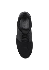 Black athletic shoe with a mesh upper, round toe, textured surface, and flat laces. Features a padded collar and tongue.