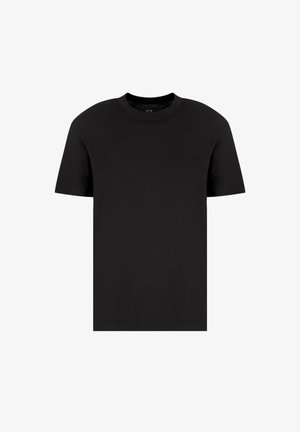 T-shirt in cotone nera con maniche corte, collo rotondo e testo in rilievo "ARMANI EXCHANGE" sul petto. Texture liscia, design semplice.