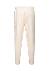 Cream-colored tapered sweatpants with elastic waistband and cuffs. Soft, textured fabric and side pockets. Simple and functional design.