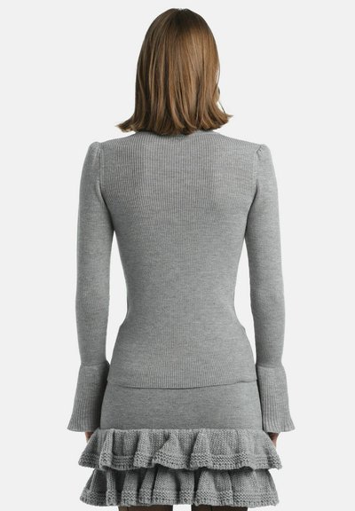 Grey ribbed sweater with long sleeves, featuring a fitted bodice and a flared hem. The material appears soft with a subtle texture.