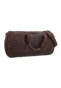 Dark brown leather duffel bag with dual handles and adjustable shoulder strap, cylindrical shape, and zip closure on top.