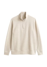 Felpa beige chiaro con collo alto, chiusura a mezza zip, maniche lunghe e polsini a costine. Tessuto morbido e strutturato.