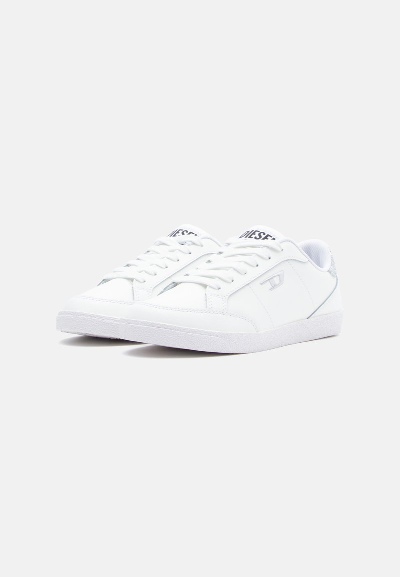 White sneakers with a smooth synthetic upper, lace-up closure, subtle silver accents, and a textured white rubber sole.