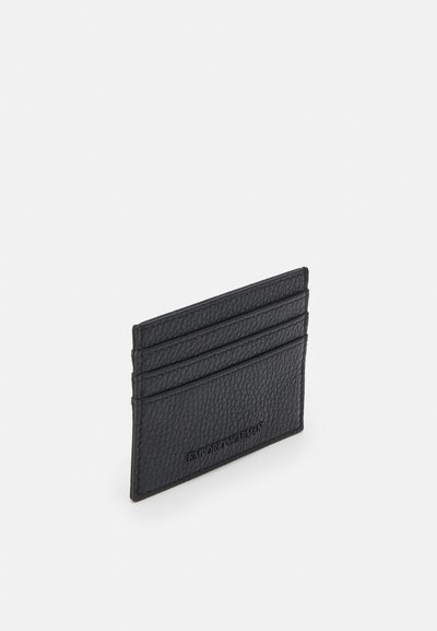 Black leather cardholder featuring textured surface, four card slots, and an embossed logo on one side. Minimalist design, rectangular shape.