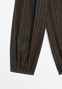 Brown fabric with thin white vertical pinstripes and cuffed ends, showing gathered detailing near the bottom.