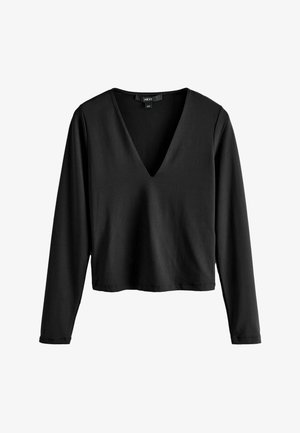 Black long-sleeve top with a V-neck design. Made of soft cotton, featuring a cropped cut and clean hems. No visible hardware or patterns.