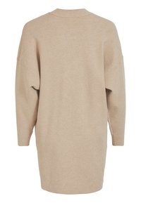 Vestito maglione beige sovradimensionato con maniche lunghe, colletto rotondo a costine e vestibilità comoda, caratterizzato da una morbida trama a maglia e fessure laterali.