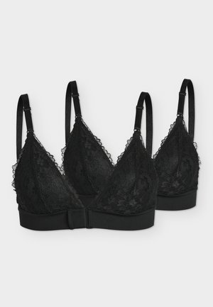 Δύο μαύρα δαντελωτά bralettes με ρυθμιζόμενους ιμάντες και μπροστινά κλεισίματα με άγκιστρα, εμφανίζονται σε ανοιχτό γκρι φόντο.