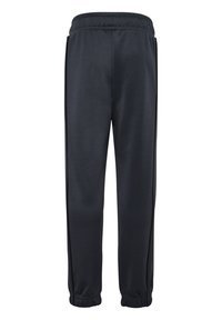 Svarta träningsbyxor med elastisk midja, tapered ben och kontrasterande sidosträck. Tillverkade av ett glatt, lättviktigt material.