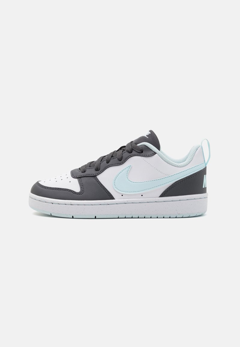 Nike sneakers with a white and gray leather upper, light blue accents, black laces, and a textured rubber sole. Notable swoosh logo on the side.