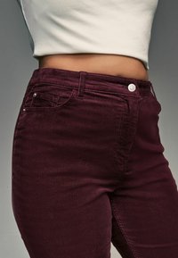 Next HOURGLASS FLARED - Housut - berry red