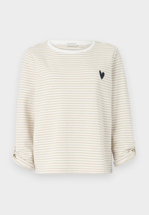 Bež in bela črtasta dolga majica z okroglim ovratnikom in majhnim črnim srcem na prsih. Zavit robovi rokavov.