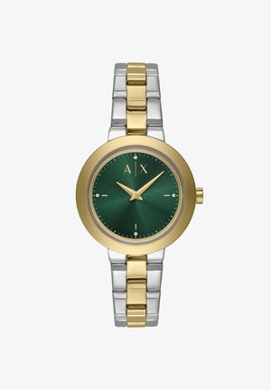 Orologio in metallo dorato e argentato con quadrante rotondo verde. Le caratteristiche includono lancette dorate, indicatori in cristallo e un bracciale bicolore.