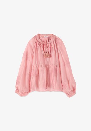 Blouse rose à manches longues, coupe ample, détails brodés, taille froncée, col rond avec lien et pompons, et poignets élastiques.