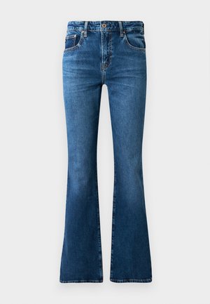 Jeans acampanados de denim azul con una cintura de media altura, cinco bolsillos, un desvanecimiento sutil y detalles de costura a lo largo de las costuras.