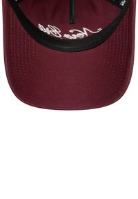 Maroon baseball cap with a smooth fabric surface, black stitching, and white embroidered text on the front panel. Curved brim design.