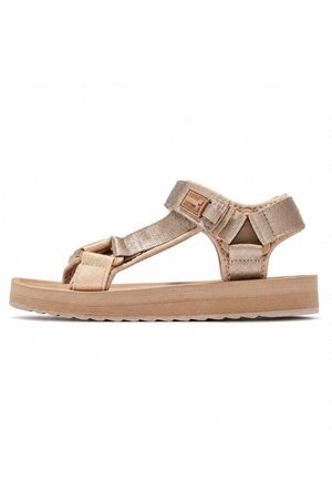 Sandalia beige con puntera abierta, tiras ajustables y suela plana y texturizada para uso casual.