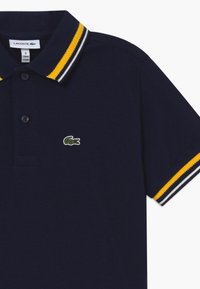 Lacoste Pikeepaita - marine