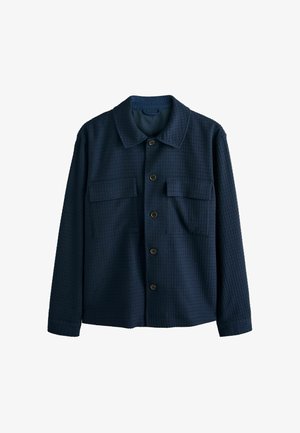 Tumesinine tekstuuriga pikkade varrukatega särgi-tagi krae, ees nööpidega sulguv ja kahe rinnataskuga.