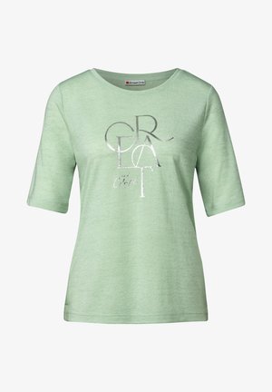 Jasnozielona koszulka z krótkim rękawem, z okrągłym dekoltem i srebrnym metalicznym napisem "GRAT and Colorful". Miękka w dotyku.