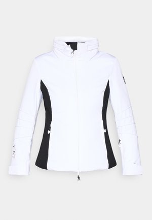 Baltas jaka ar melniem sānu paneļiem, augstu apkakli un rāvējslēdzēju priekša. Iezīmē papildus rāvējslēdzējus uz piedurknēm un logotipa detaļu apakšmalā.