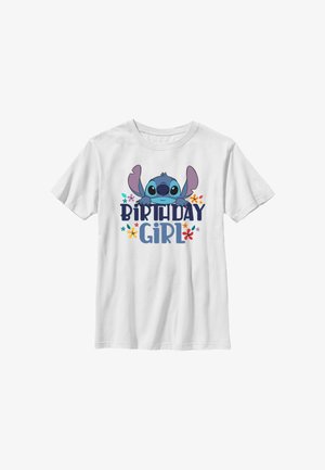 T-shirt blanc avec personnage de dessin animé bleu et fleurs colorées au-dessus du texte "Birthday Girl" en police ludique.