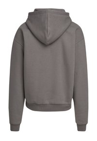 Haut gris court avec capuche à cordon, manches et taille côtelées. Design simple en tissu doux, sans motifs ni graphiques visibles.