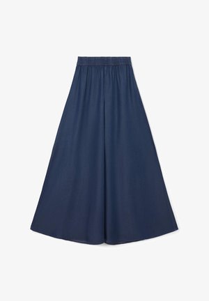 Culotte ampi navy con elastico in vita, realizzati in tessuto leggero, caratterizzati da una texture liscia e da una silhouette morbida.